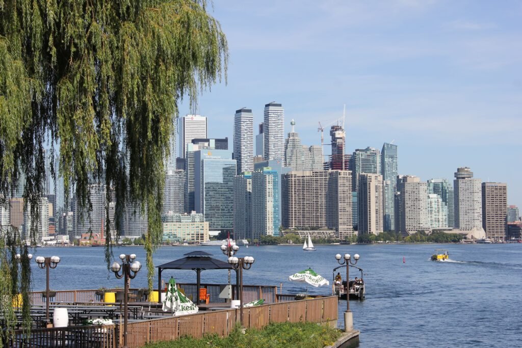 View of Toronto downtown skyline and skyscrapers across the blue water from the harborfront
