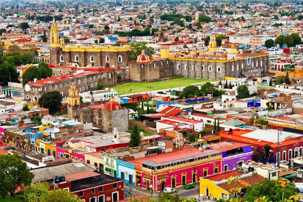 Cholula world's largest pyramid and hilltop church with scenic volcano views