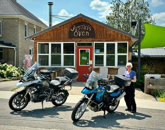 Justin's Oven restaurant exterior and artisanal pizza dining setting in Meaford