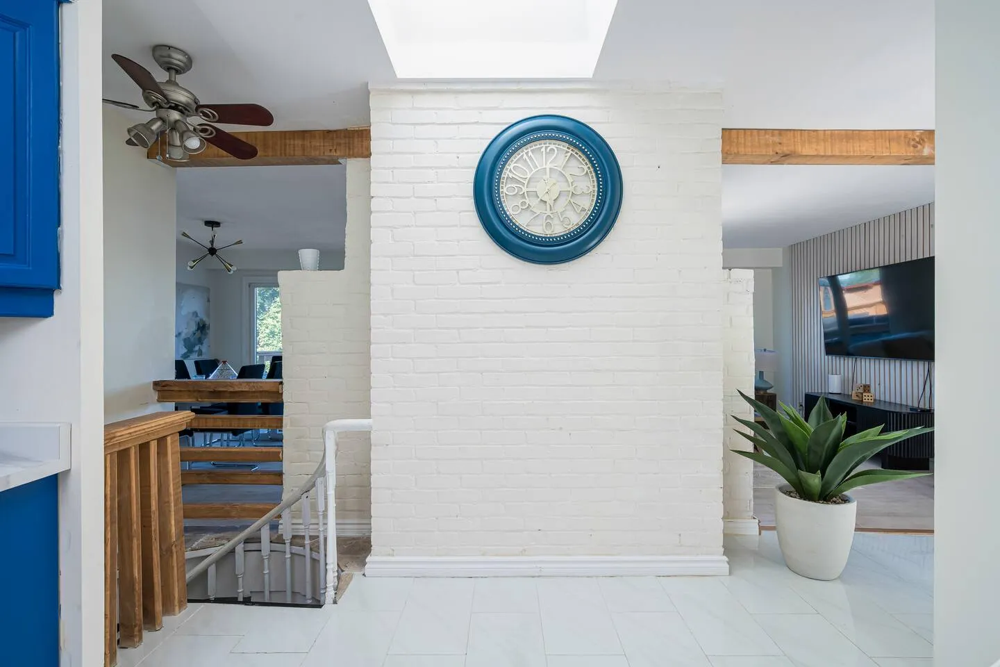 Bright interior hallway with wall art at The Bluffs Bayhouse