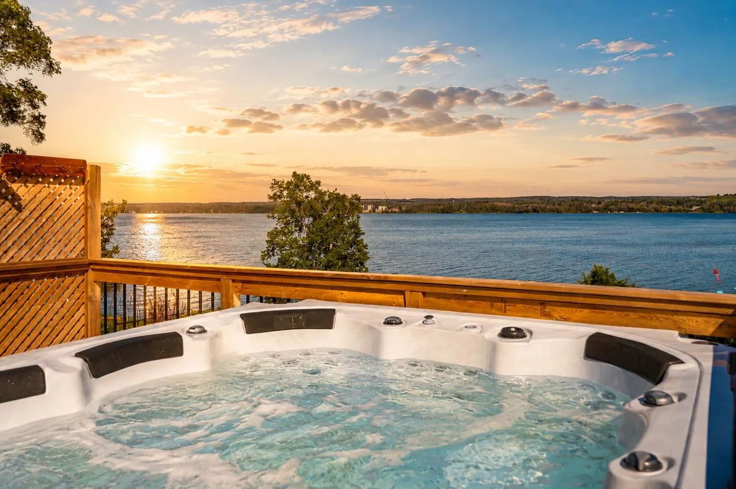 Outdoor hot tub overlooking the water at The Bluffs Bayhouse