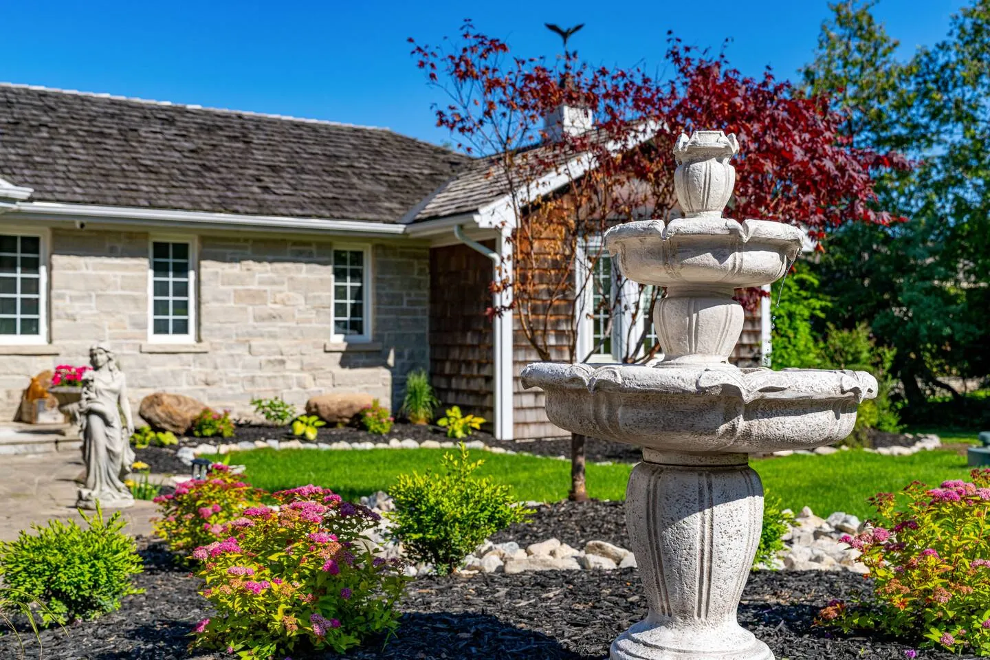 Garden fountain and exterior details at The Bluffs Bayhouse