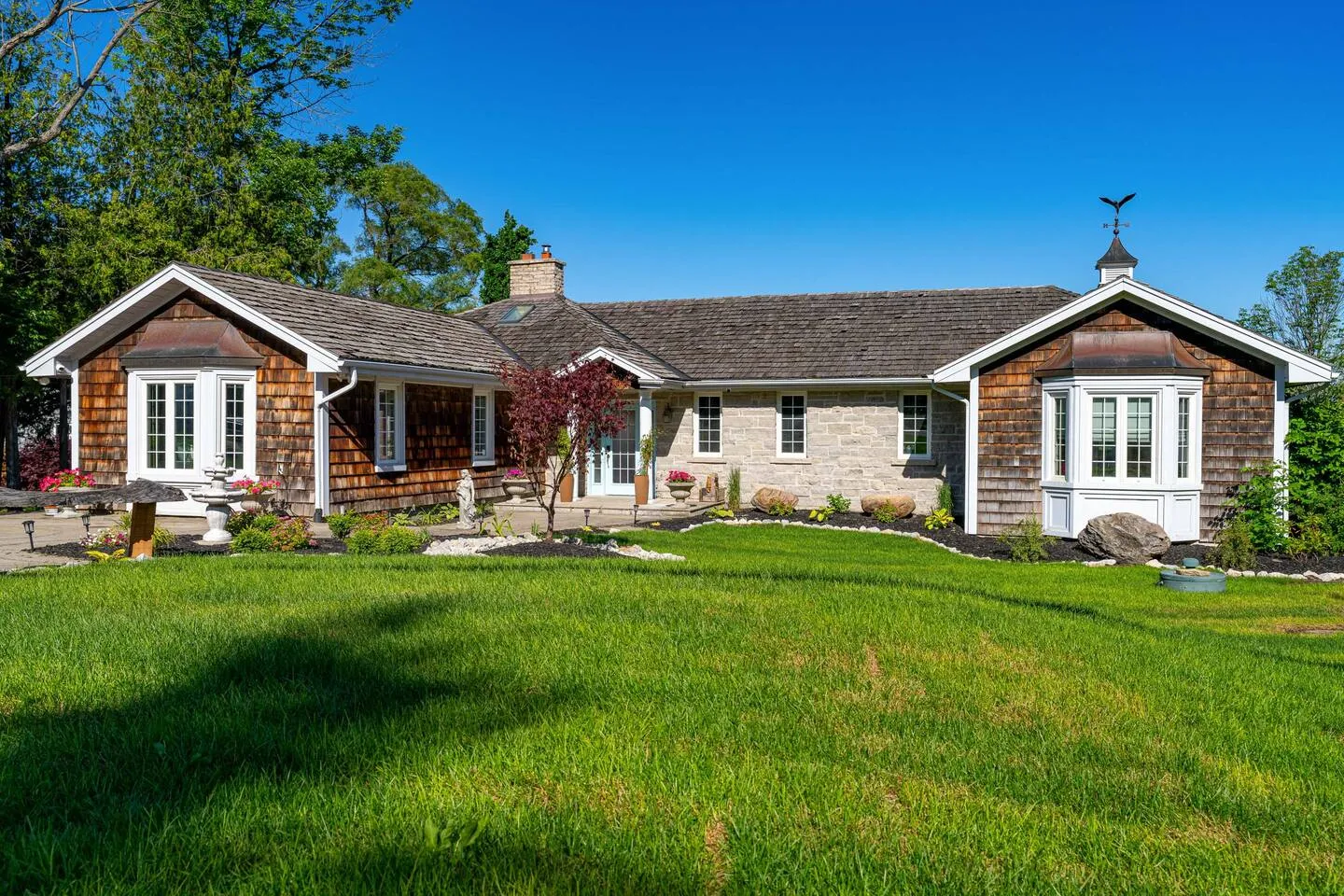 Wide shot of The Bluffs Bayhouse and its spacious grounds