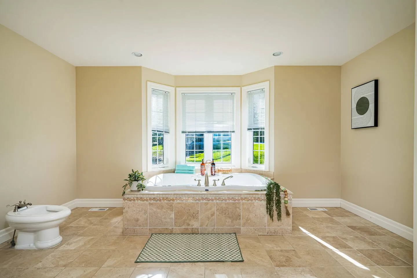 Bathroom with large bathtub at The Bluffs Bayhouse
