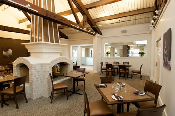The Pottery Restaurant classic dining room interior and cozy fireplace setting in Blue Mountain