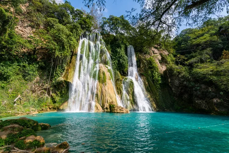 Guestwork local guides scenic waterfall landscape representing destination exploration